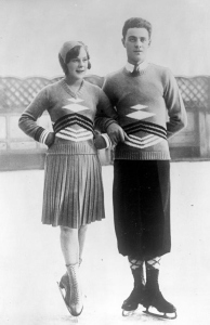 1932 Photograph of a male and a female ice skater, each wearing a multi-coloured, graphic design, intarsia sweater.