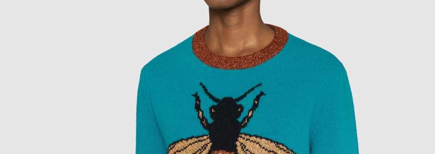 Gucci turquoise wool sweater with intarsia bee motif with brown trim.