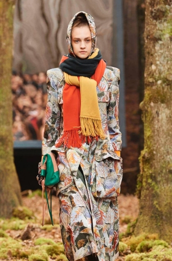 Chanel colour block, long shawl in yellow, brown and orange, worn bundled around the neck.