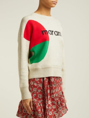 Woman wearing relaxed fit, knitted sweater in cream, with red and green intarsia circle across side and Marant logo across front.