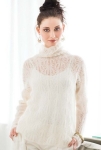 Model wearing lightweight knitted, polo-neck sweater with pretty all-over lace design, in white. Knitting pattern by Yoko Hatta. photo copyright SoHo Publishing.