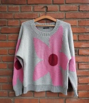 Knitted sweater in pale grey with large, pink and red floral intarsia motif across the front and with similar motifs across the sleeves.
